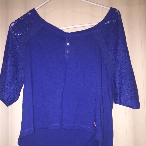 Blue Hollister shirt with lace on the arms.