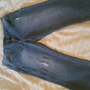 Semi-distressed capri jeans.