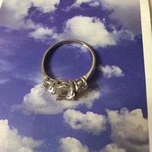 925 white sapphire three stone ring.