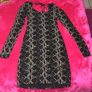 A snakeskin glitter mini open back dress!