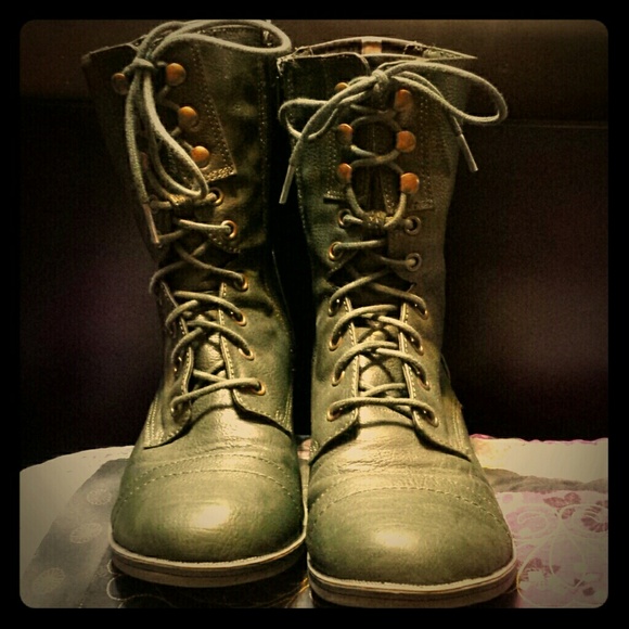 Calf length lace up boots