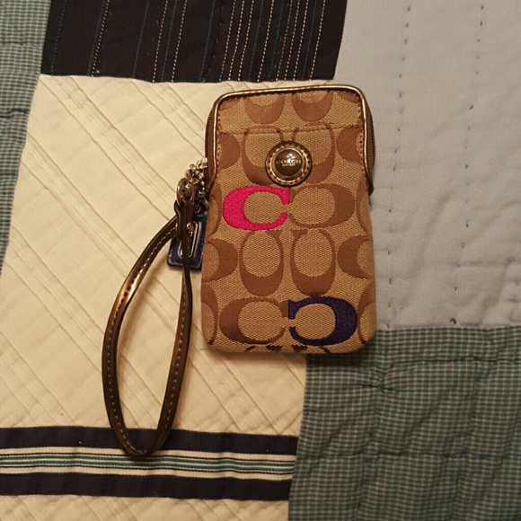 A colorful coach wristlet