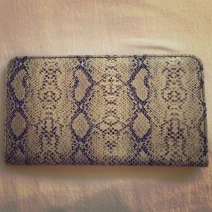 Snakeskin patterned clutch