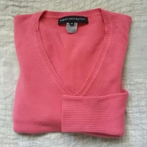 Form fitting light pink sweater/ shirt