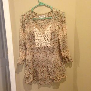 a cream based, floral shirt.