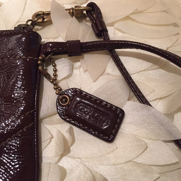 Coach brown patent leather coach wristlet