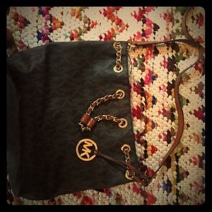 Michael kors brown bag with gold chain.