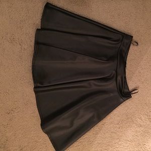Black leather skater skirt. New with tags.