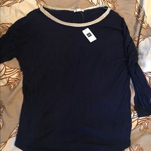 Navy blouse with gold detail around collar