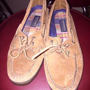 Genuine Tan Sperrys with plaid inserts.