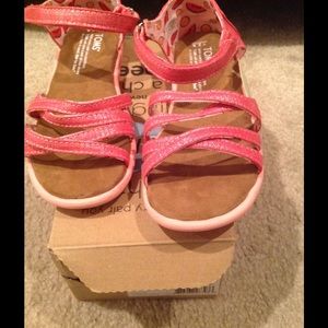 Youth sized pink TOMS sandals