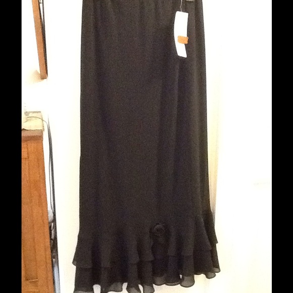 A-Line maxi skirt with ruffles along hem.