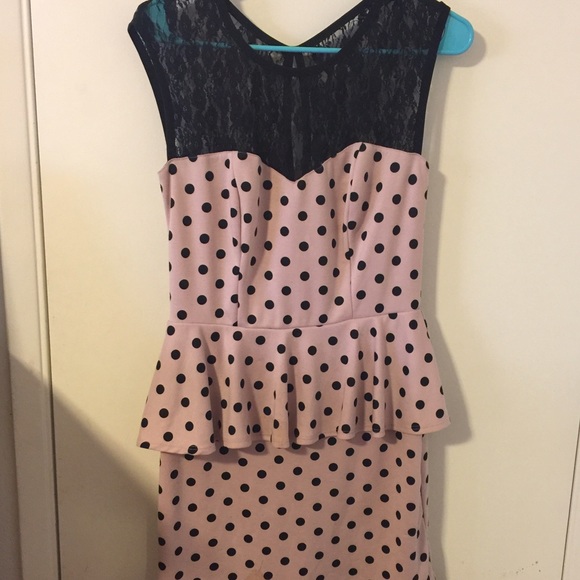 A pink and black polka dot dress