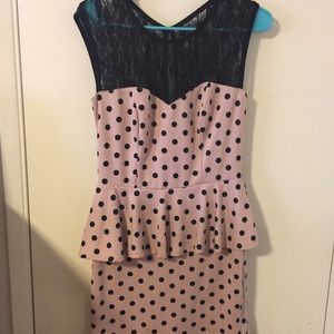 A pink and black polka dot dress