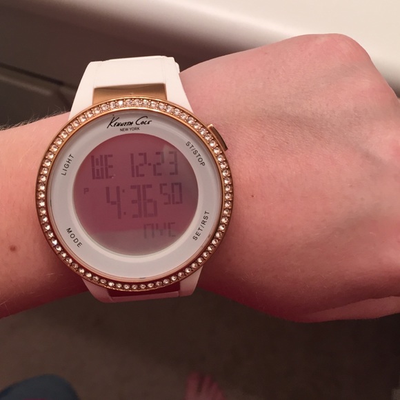 White watch with rhinestones around the face