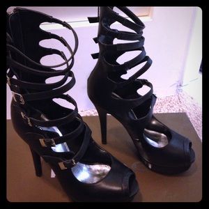 BEBE "Deirdre" gladiator style platform heels.