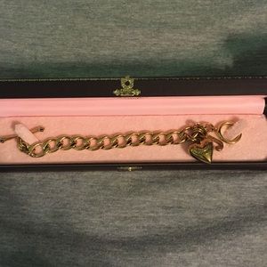 Gold Juicy Couture charm bracelet with charm
