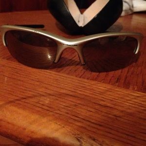 Gold and black oakleys