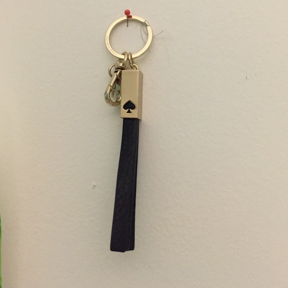 Brand new gold and leather Kate Spade Tassle