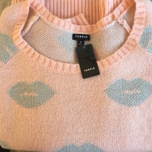 Pink sweater with sparkly silver lips