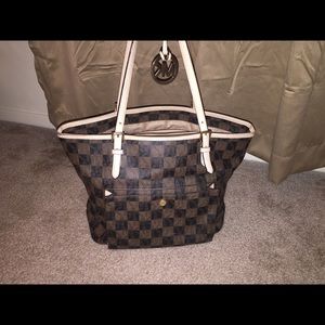 Brown Michael Kors medium tote purse.