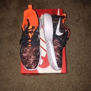 Orange/Black/White camo print Roshe one sneakers