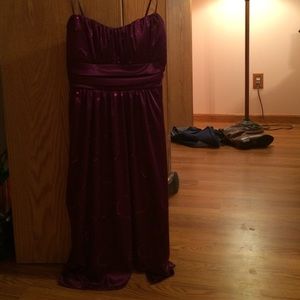 Purple, silky mid length dress.