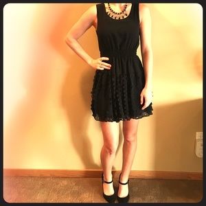 Black sleeveless dress with circle detail