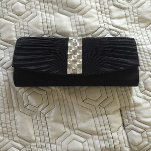 Black clutch with a silver chain