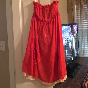 Strapless orange dress.