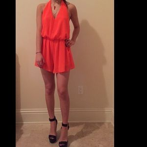 Open back orange romper
