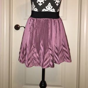 Pleaded purple satin skirt