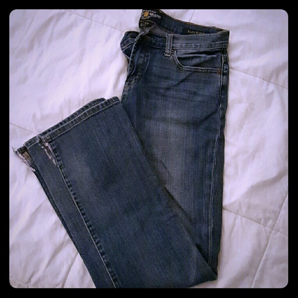 Lucky Jeans with small cuts on the bottom.