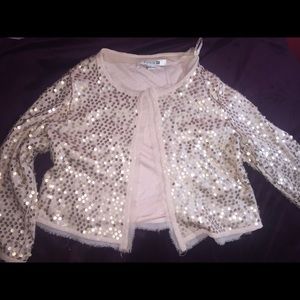 Nude shimmery cardigan .