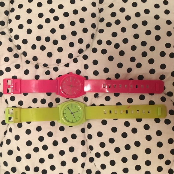 Neon pink and green Nixon watches