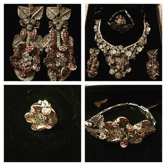 Silver set with emerald stones