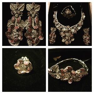 Silver set with emerald stones