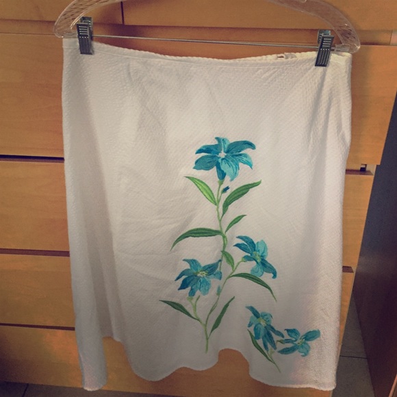 White skirt with turquoise flowers