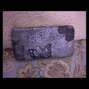 Silver clutch purse with butterfly design