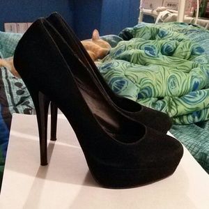 A pair of All Black High Heels
