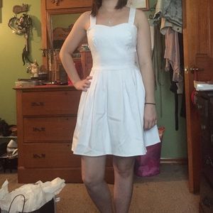 White summer dress with bow in the back.
