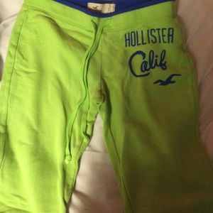 Green sweatpants with blue writing
