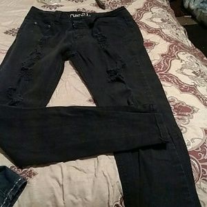 Distressed black skinny jeans
