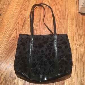 Black bag with a velvet flower design
