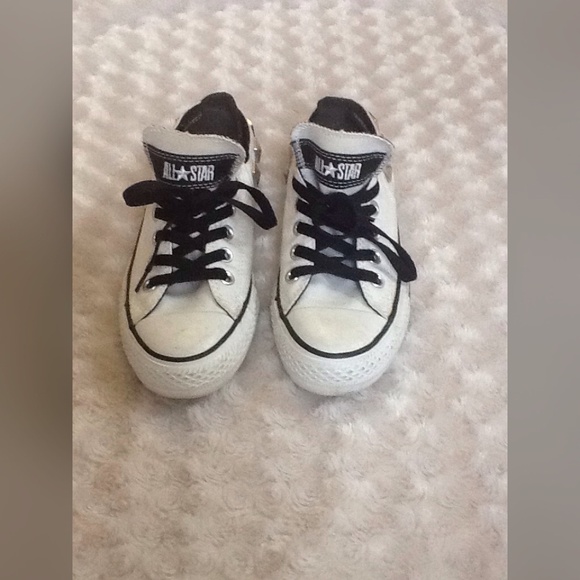 Black and white studded converse.