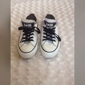 Black and white studded converse.