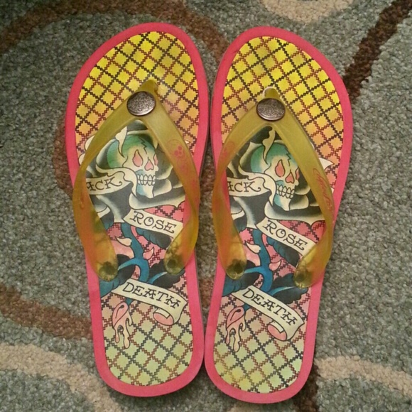 Ed Hardy flip flops.
