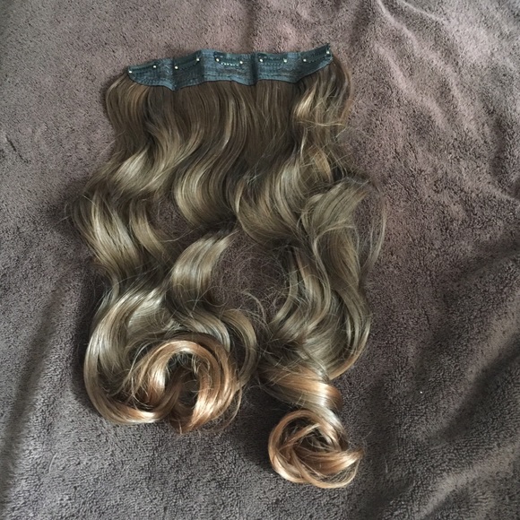 Light brown curled extensions.