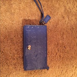Dark blue patent leather signature wristlet/wallet