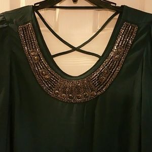 Blouse with embellished neckline